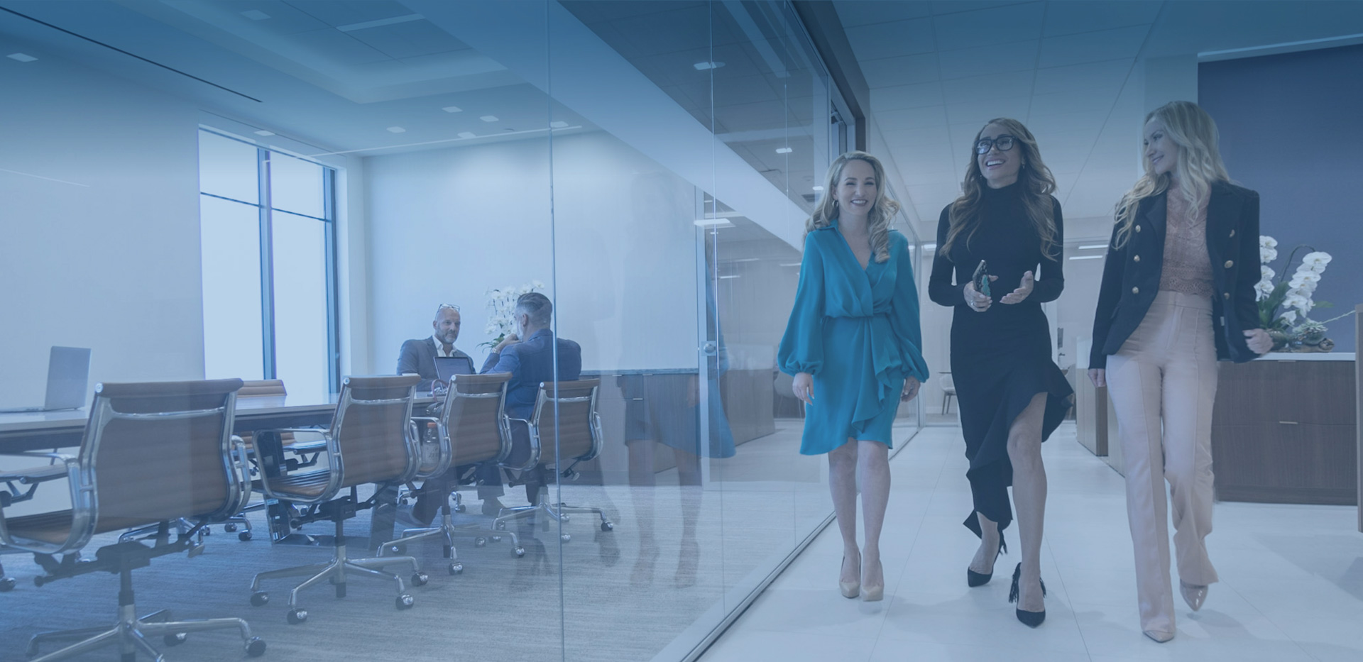 Three business women walking in a glass office, in the style of dark teal and light gray, highly staged scenes, smilecore, immersive environments, precisionist style, meticulously crafted scenes, rich and immersive