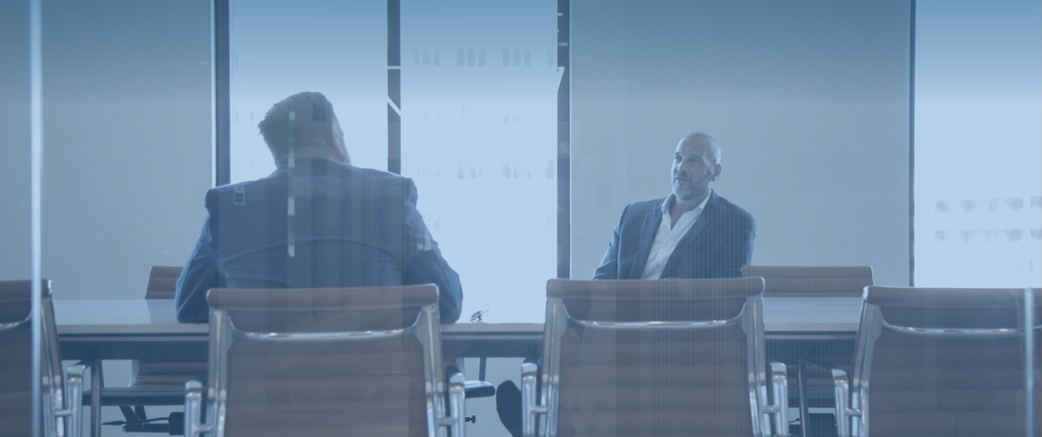 an image of a man and businessman meeting in a conference room, in the style of hazy, dreamlike quality,